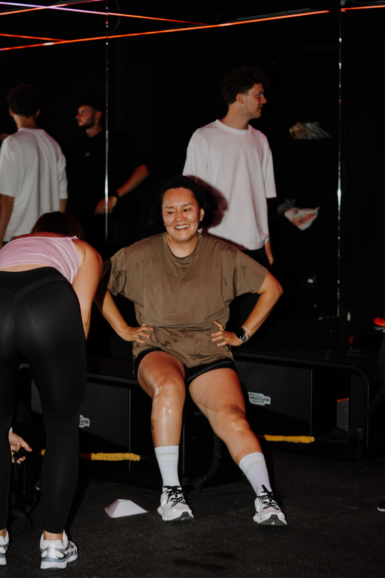 Members smiling after an effort block in the ONE PULS Boost room, Brussels